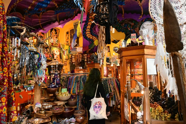 a woman is walking inside a large store