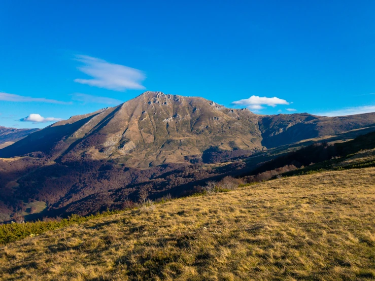 an expansive view of a mountain with no clouds