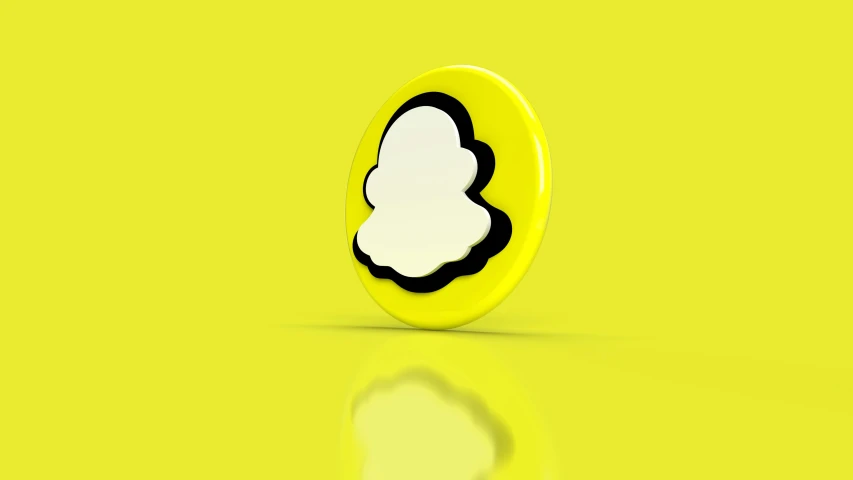 a yellow oval shaped object on top of a reflective surface