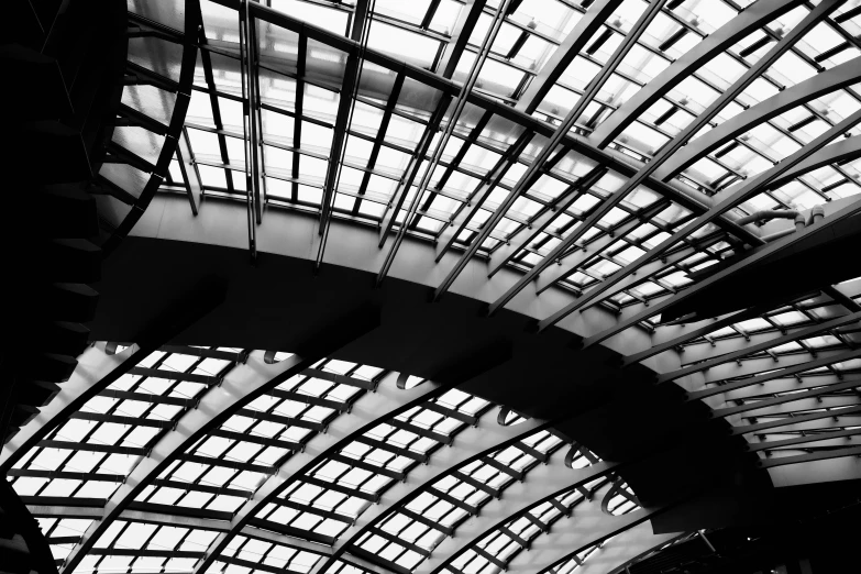 the inside of an indoor shopping mall with multiple layers of windows