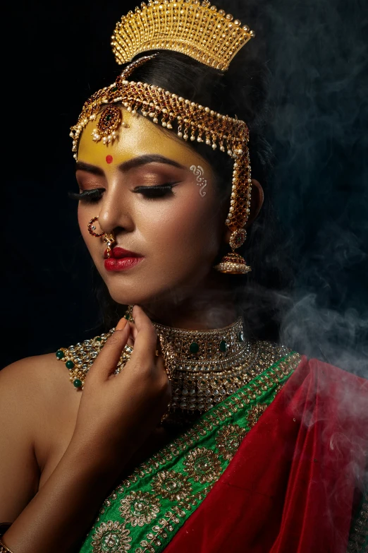 a woman in a traditional garb is smoking a cigarette