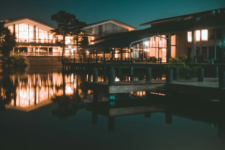 a view of a home and a river at night