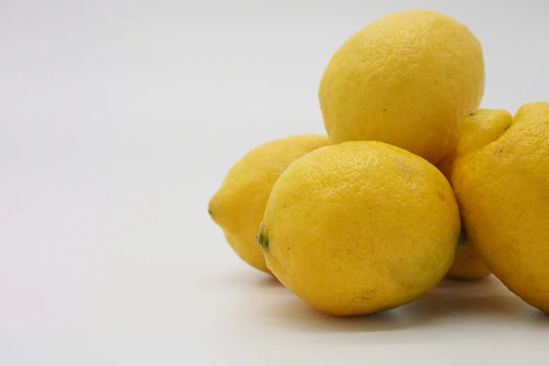 the four lemons have been placed on top of each other