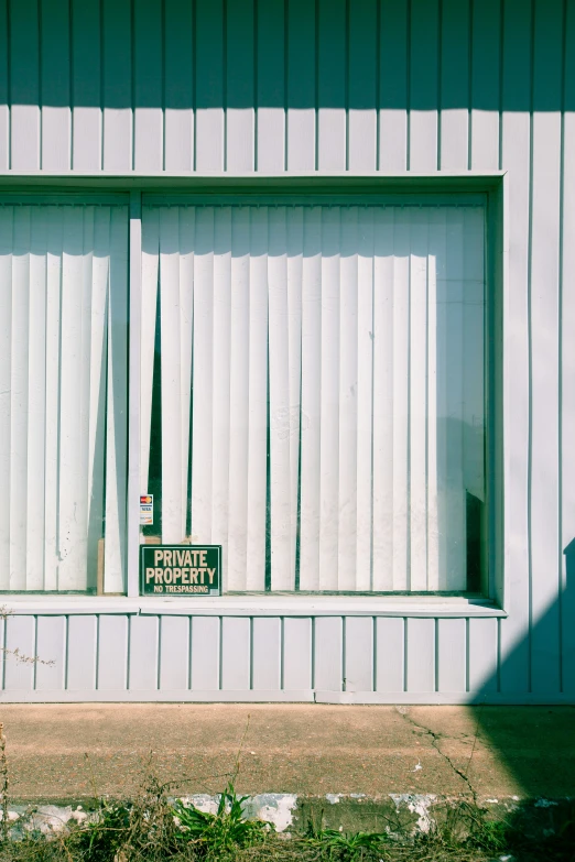 a sign sits in the window of a building