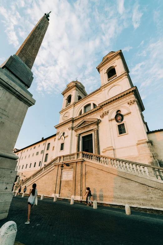 a big building that has a tall spire on it