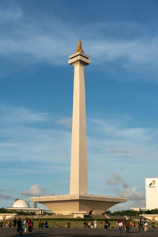 people in a square near the top of a monument