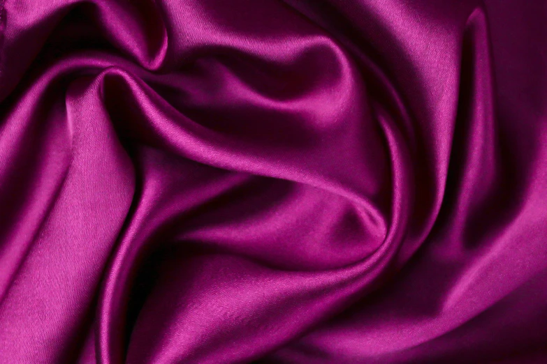 a pink fabric is seen close up