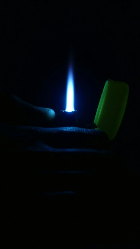 a blue candle with glow on it