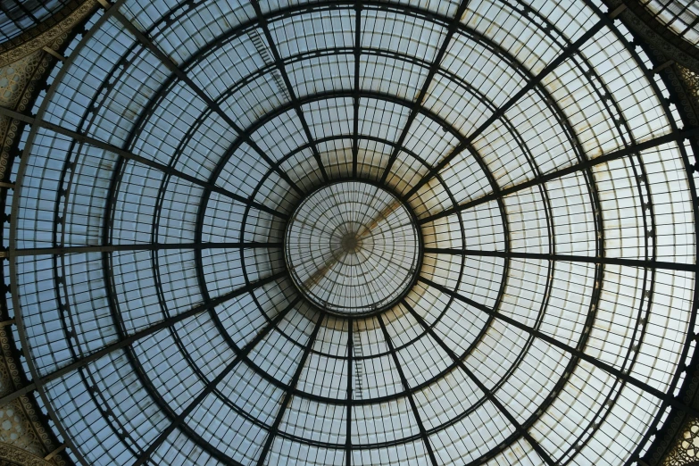 an ornate glass roof above a metal structure