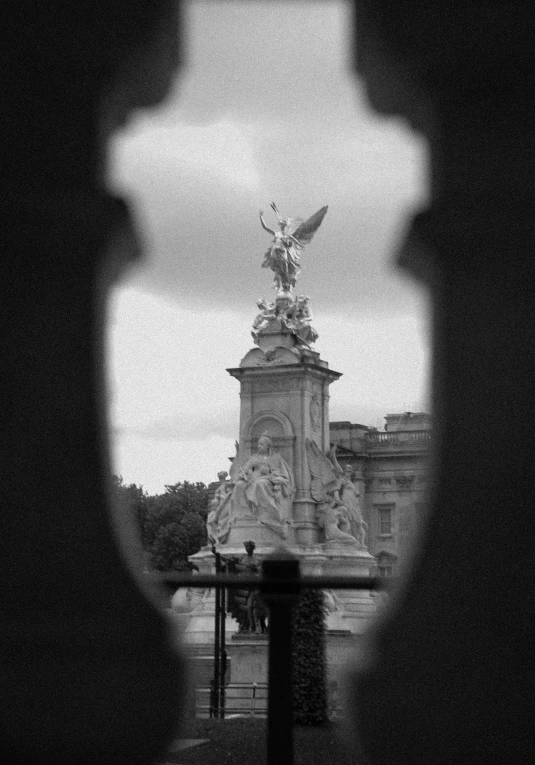 black and white pograph of a statue with a sky background