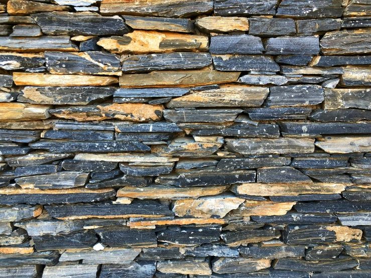 a pile of different sized rocks are stacked on top of each other