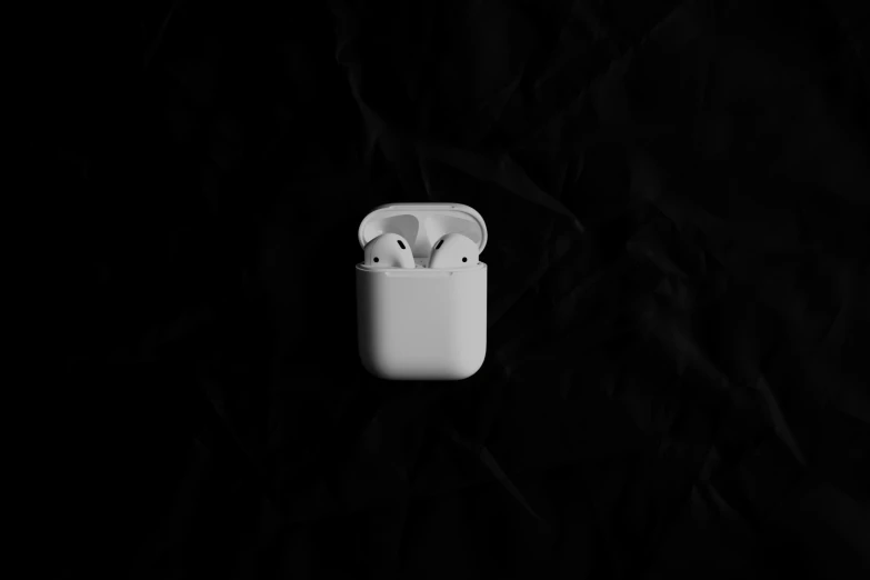 the two apple airpods are next to each other