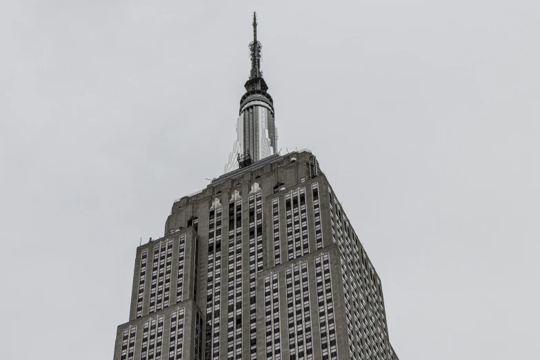 a large, steep building rises up from the sky