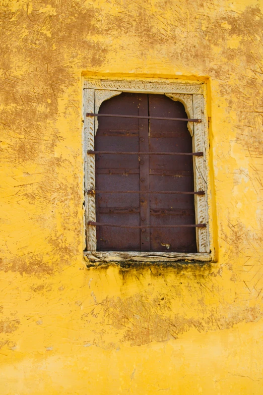 a window and bars on the side of a building