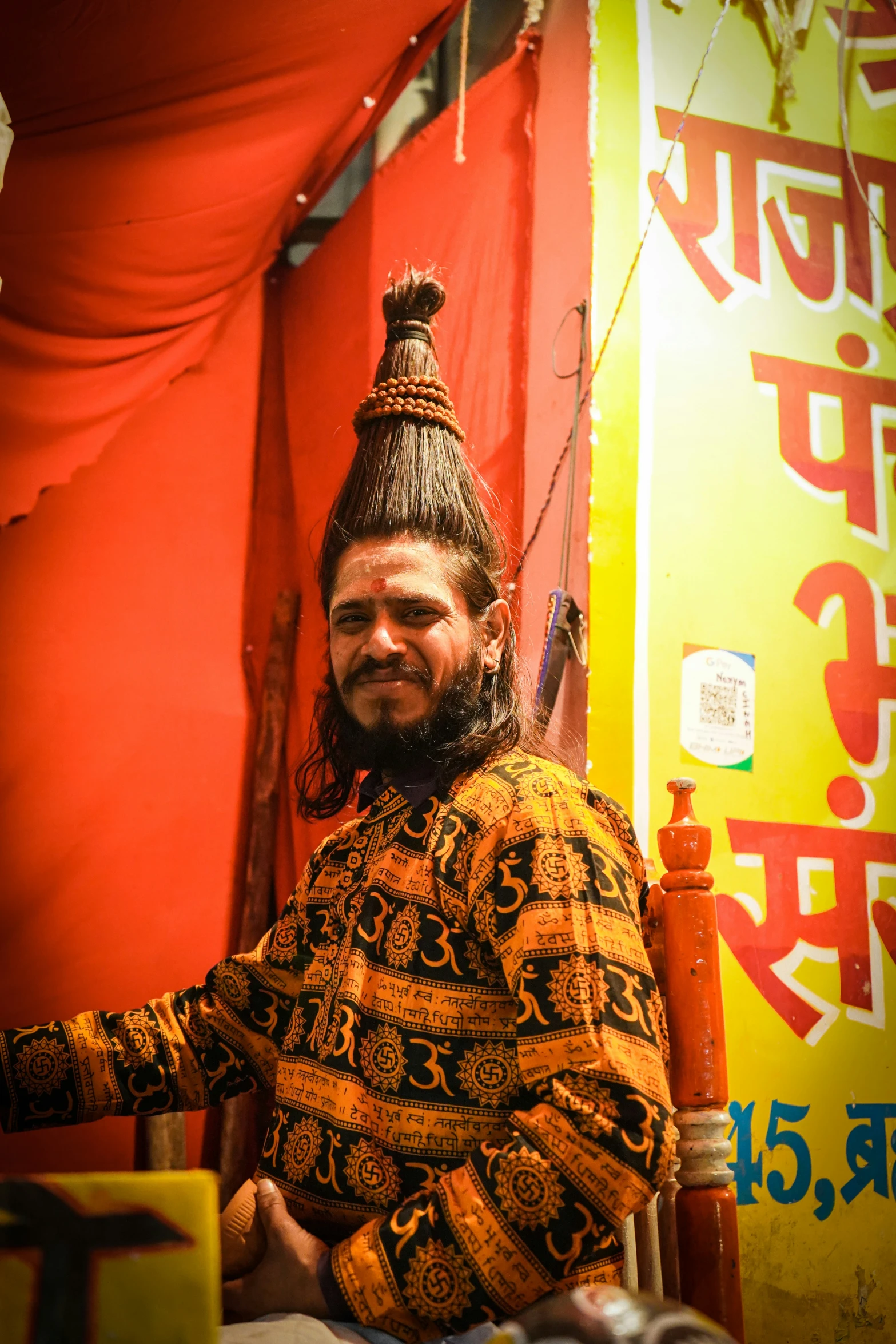 a man dressed in a yellow and black outfit is smiling