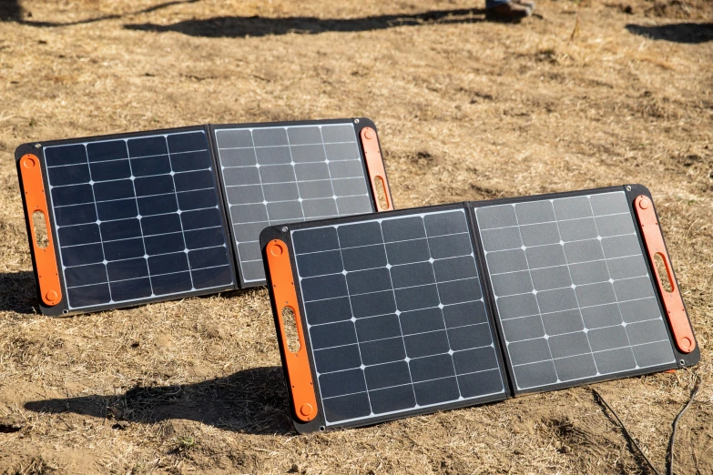 two black and orange pieces of solar powered electronic equipment