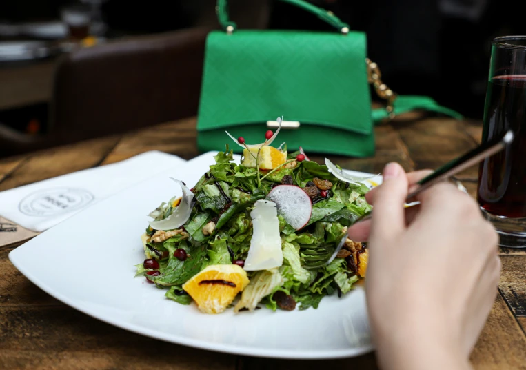 the salad is prepared to be eaten with utensils