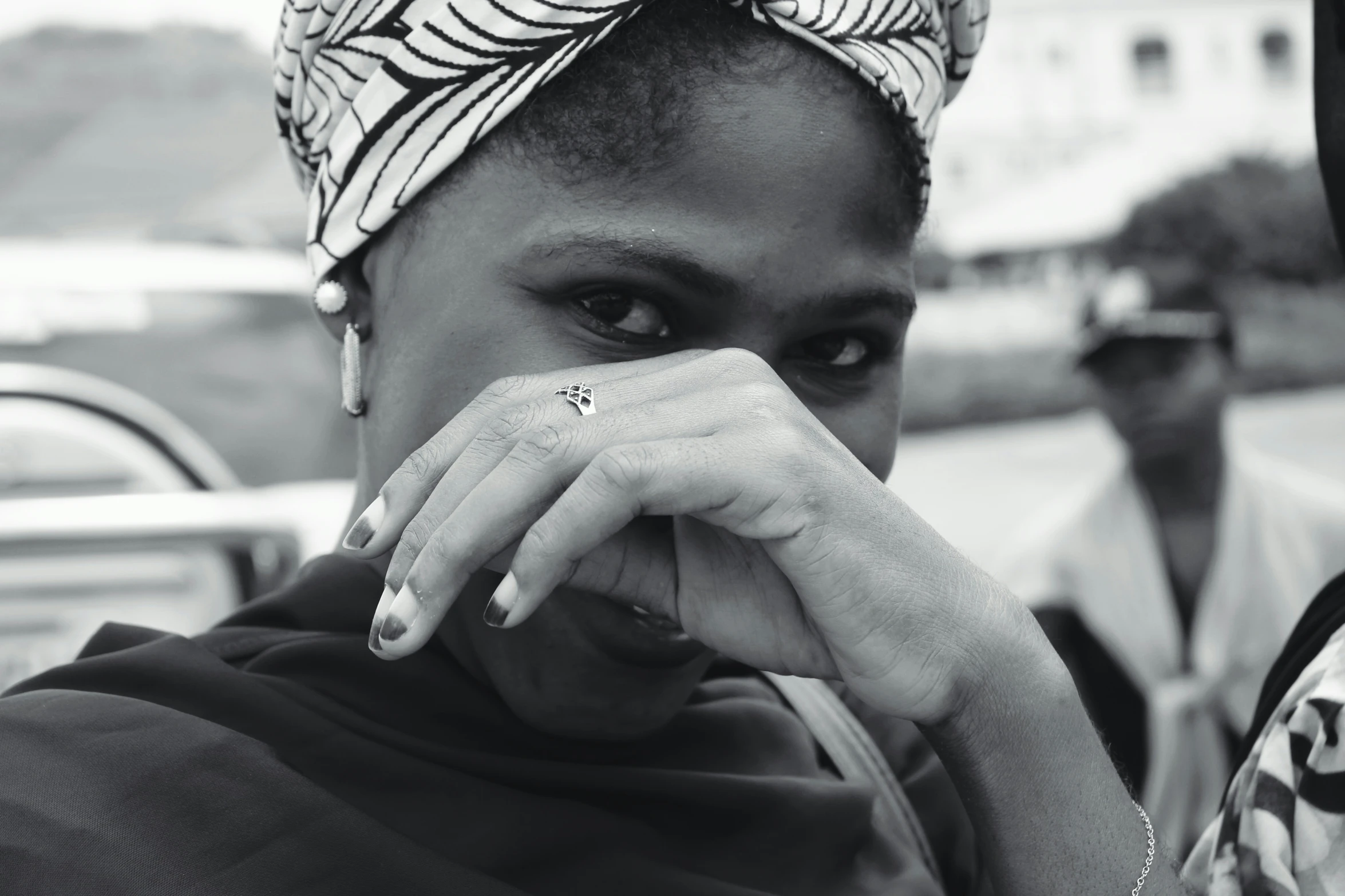 a close up of a person with a bandana on