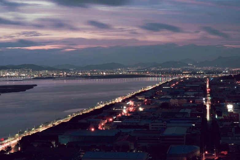 a view of a city at night looking over a body of water