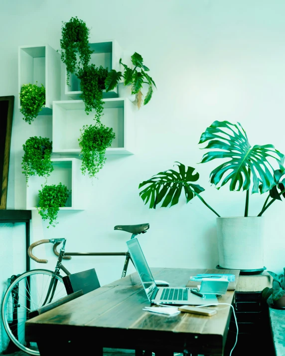 there is a wooden table with a laptop on it