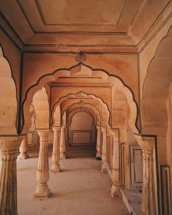 a hallway with columns leading into the distance