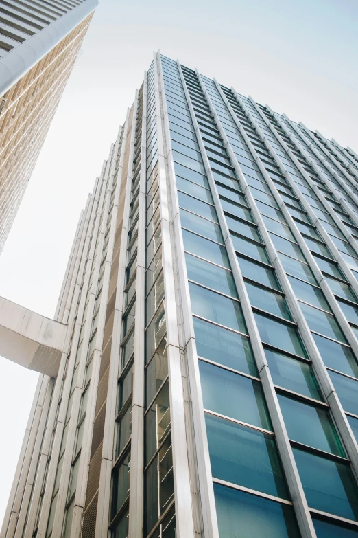 the windows of a very large building as seen from the ground