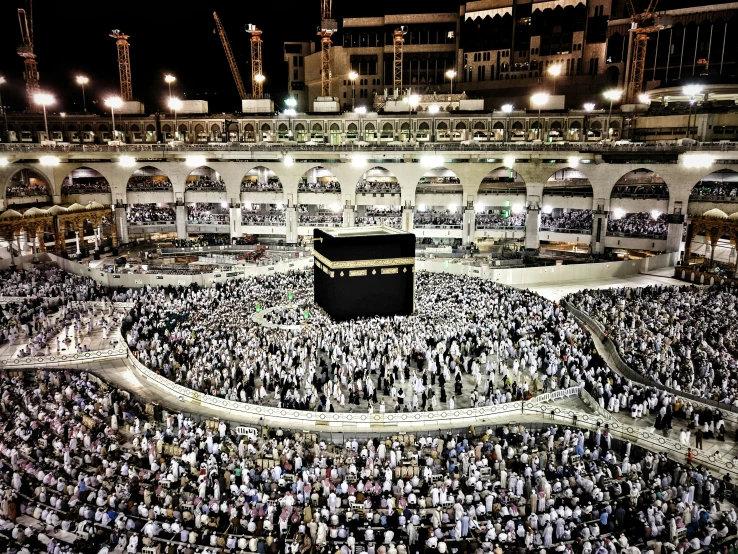 an overview from above of a very large crowd of people and a kabab