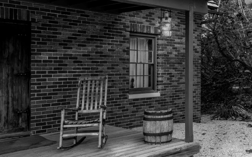 a large rocking chair on top of a wooden deck