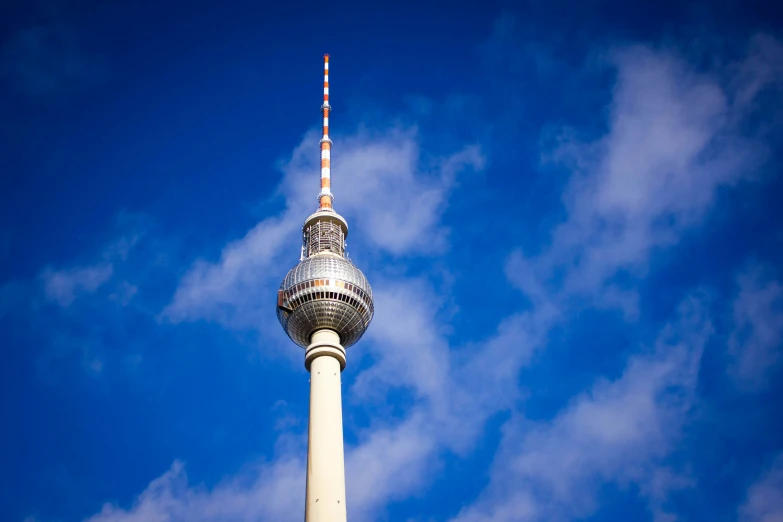 the television tower is against the blue sky