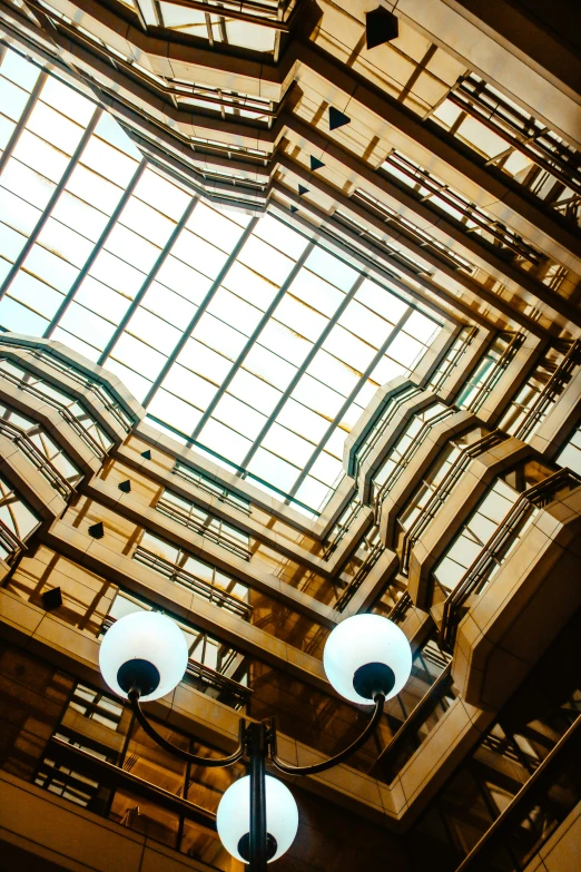 the ceiling in a building with a tall clock tower