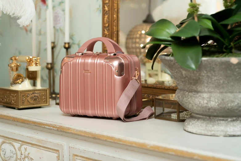 a pink purse sitting on top of a table