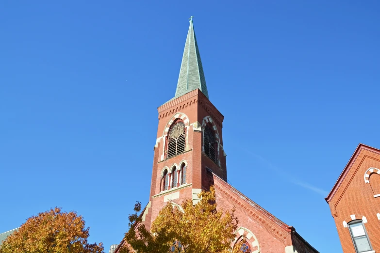 a tall building with a very steeple in the sky