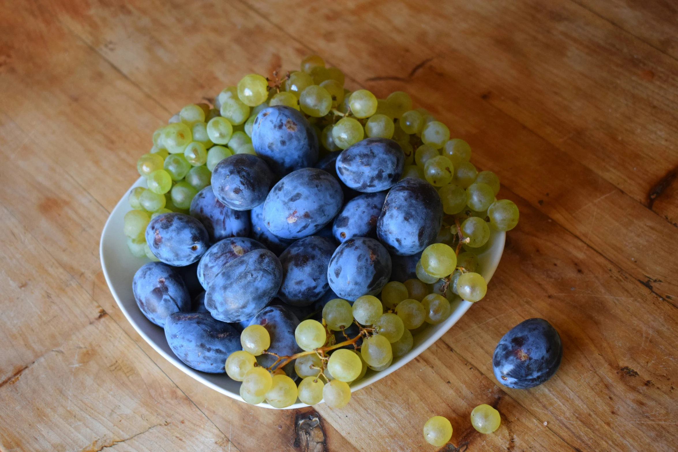 gs are arranged in a bowl on a table