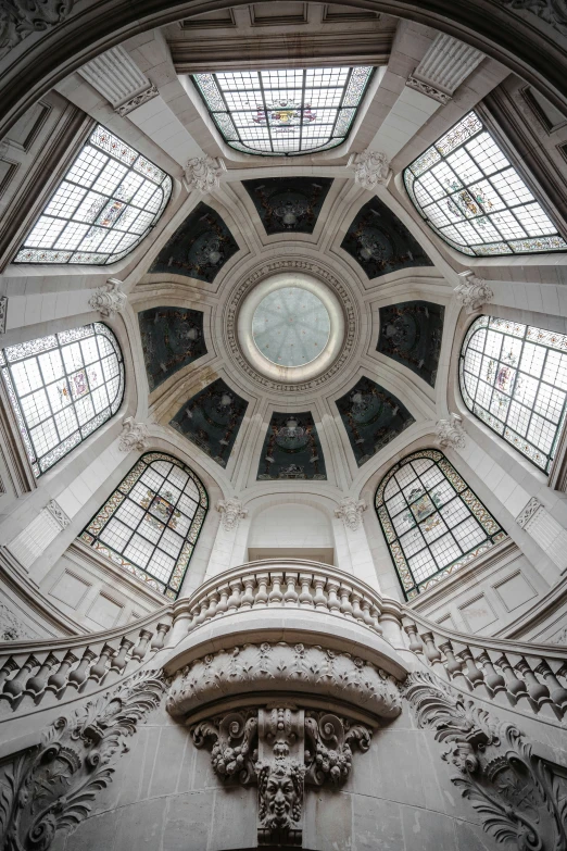 an old building has two massive windows in the center