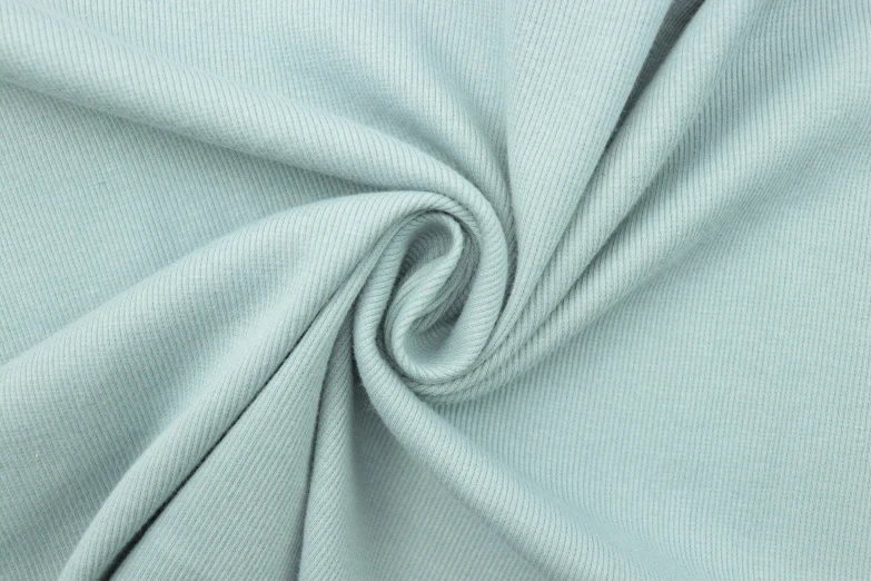 the fabric of a plain light green material