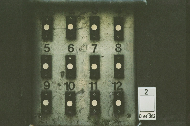 there is a small door with many numbers on it