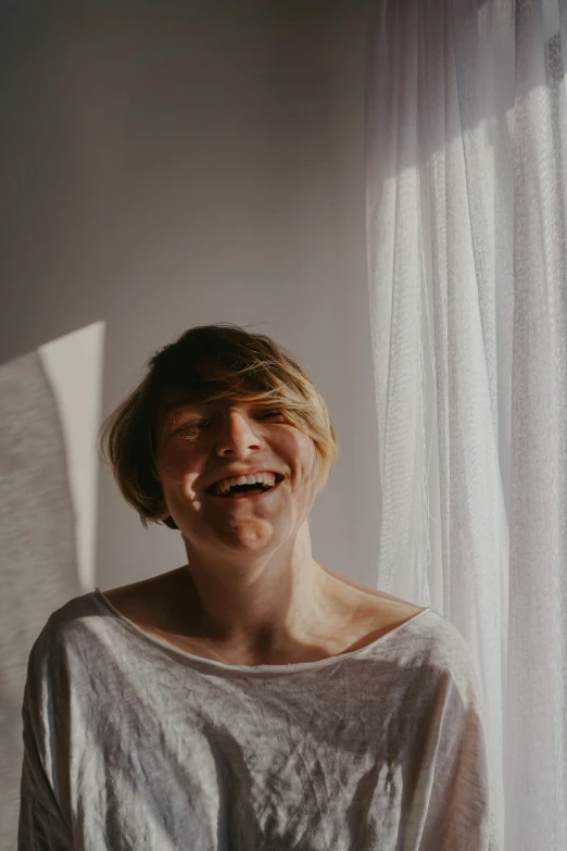 a woman looking at the camera while smiling