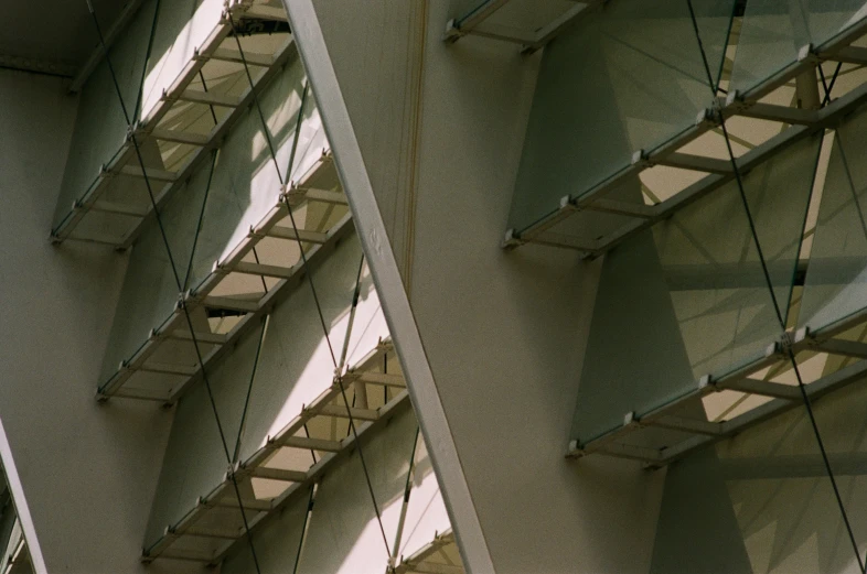 two different angles of an atrium with hanging planes