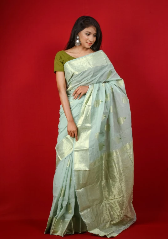 a woman wearing an indian style sari and smiling