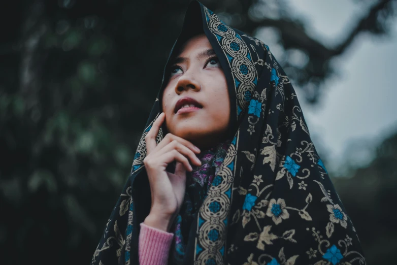 a woman in an oriental looking dress