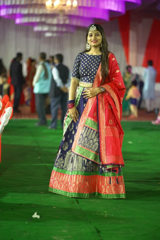 a girl poses for the camera as she wears a bridal gown