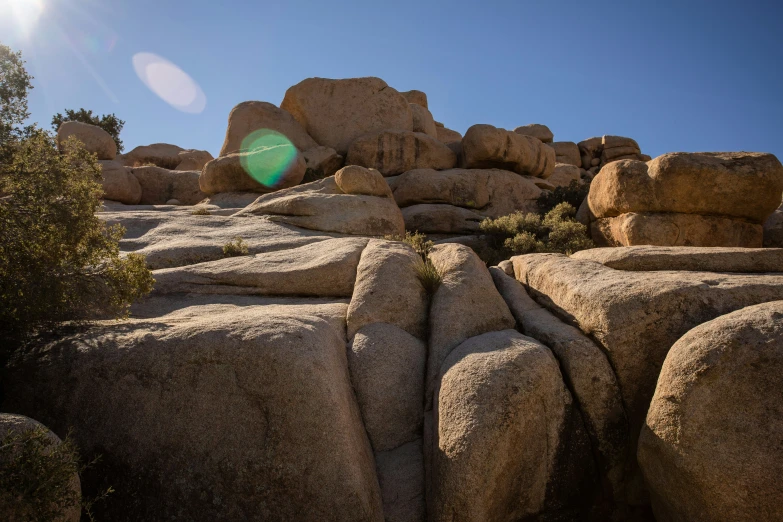 a sunny sky above some rocks