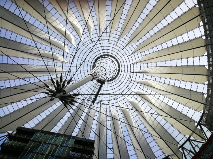 a large white umbrella has a lot of windows