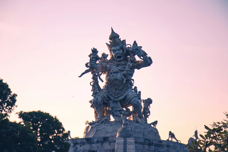 there is a very large statue on top of a building