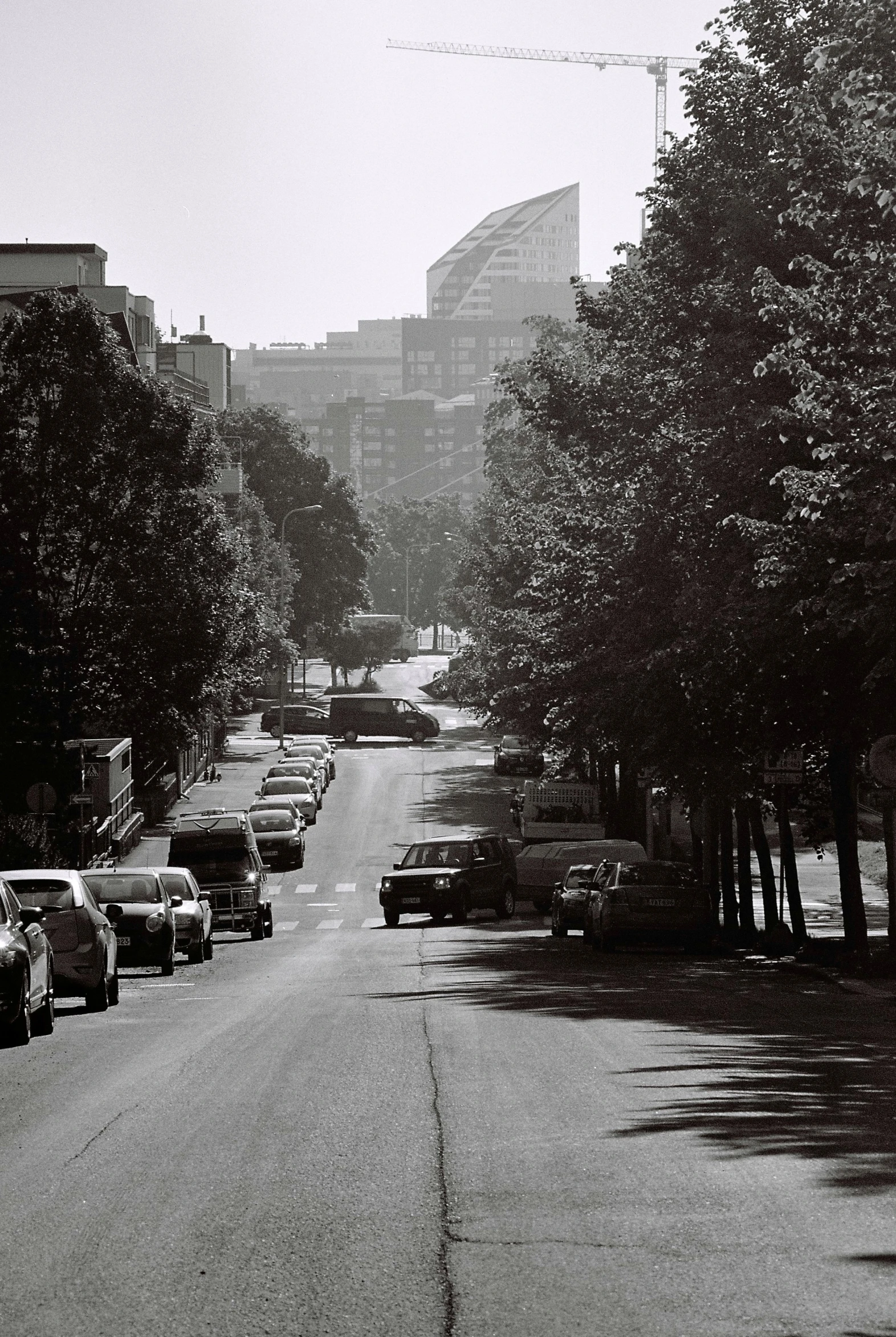 cars are parked on a wide street