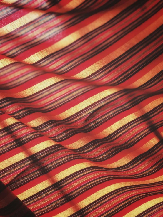 a red and yellow sheered cloth with very large lines