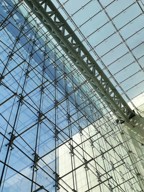 the inside of a building that looks like it is covered in glass