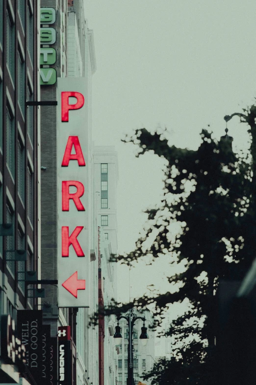 a city street sign that is lit up with the lights on