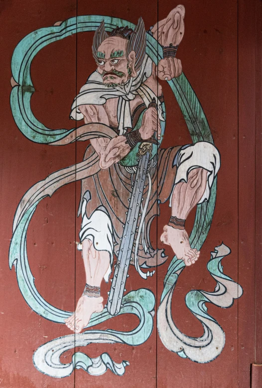 chinese painting on the side of a building