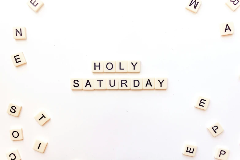 scrabble tiles spell out the word'holy saturday '